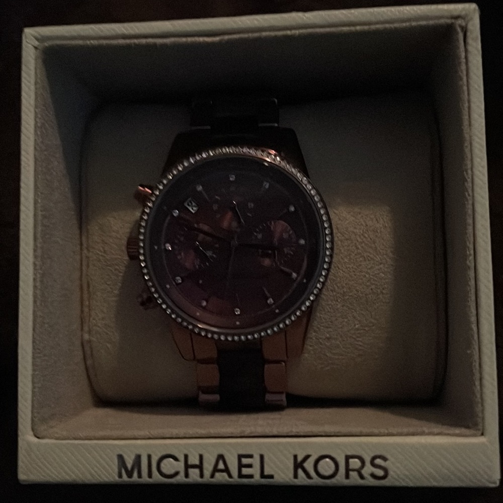 Metallic purple Never worn purple band and face face is surrounded by CZ’s
